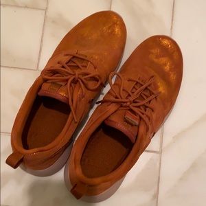 Burnt orange metallic Nike Roshe shoes